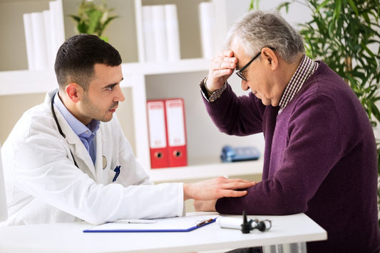 Man explaining to the doctor his head pain