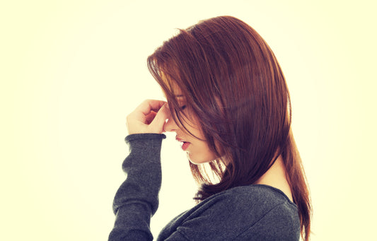 Woman Experiencing a Sinus Headache