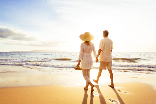 Couple in Golden Years Walking Along the Beach