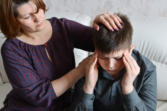 Mother with son who has a cluster headache