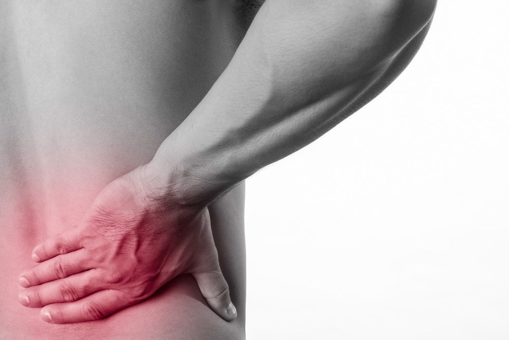 Man Suffers from Lower-back Pain Received During an Injury
